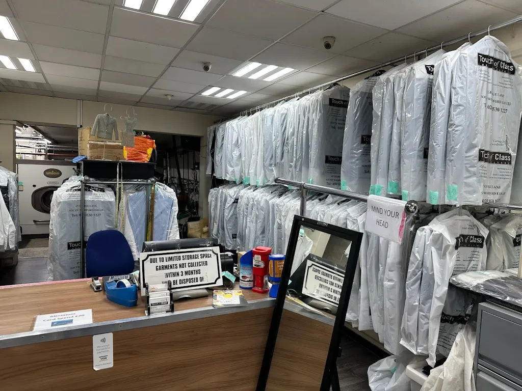 Touch of Class Dry Cleaners.